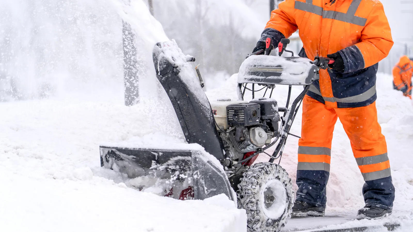 IPM crew clearing snow with a snowblower